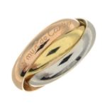 A 'Les Must de Cartier Trinity' ring, by Cartier.Signed Cartier.Stamped 750.Ring size I1/2.