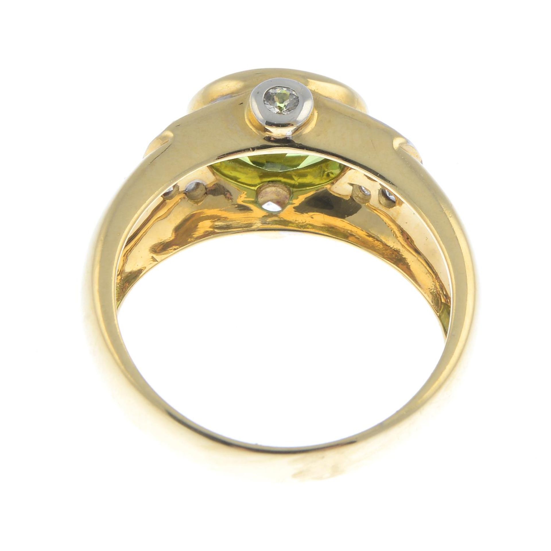 A 9ct gold peridot and cubic zirconia dress ring.Hallmarks for 9ct gold. - Image 2 of 3