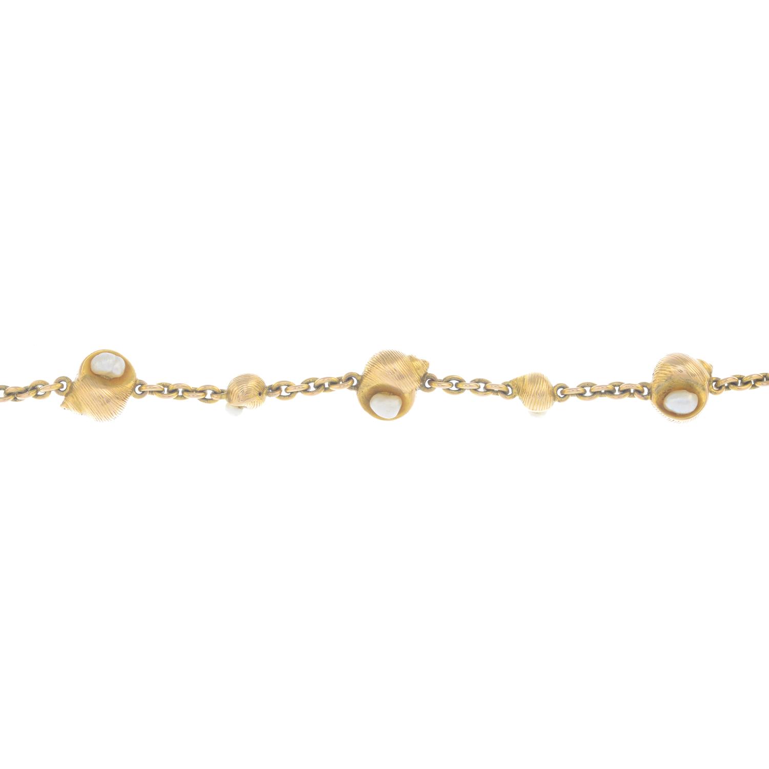 A bracelet, designed as a series of alternating conches,