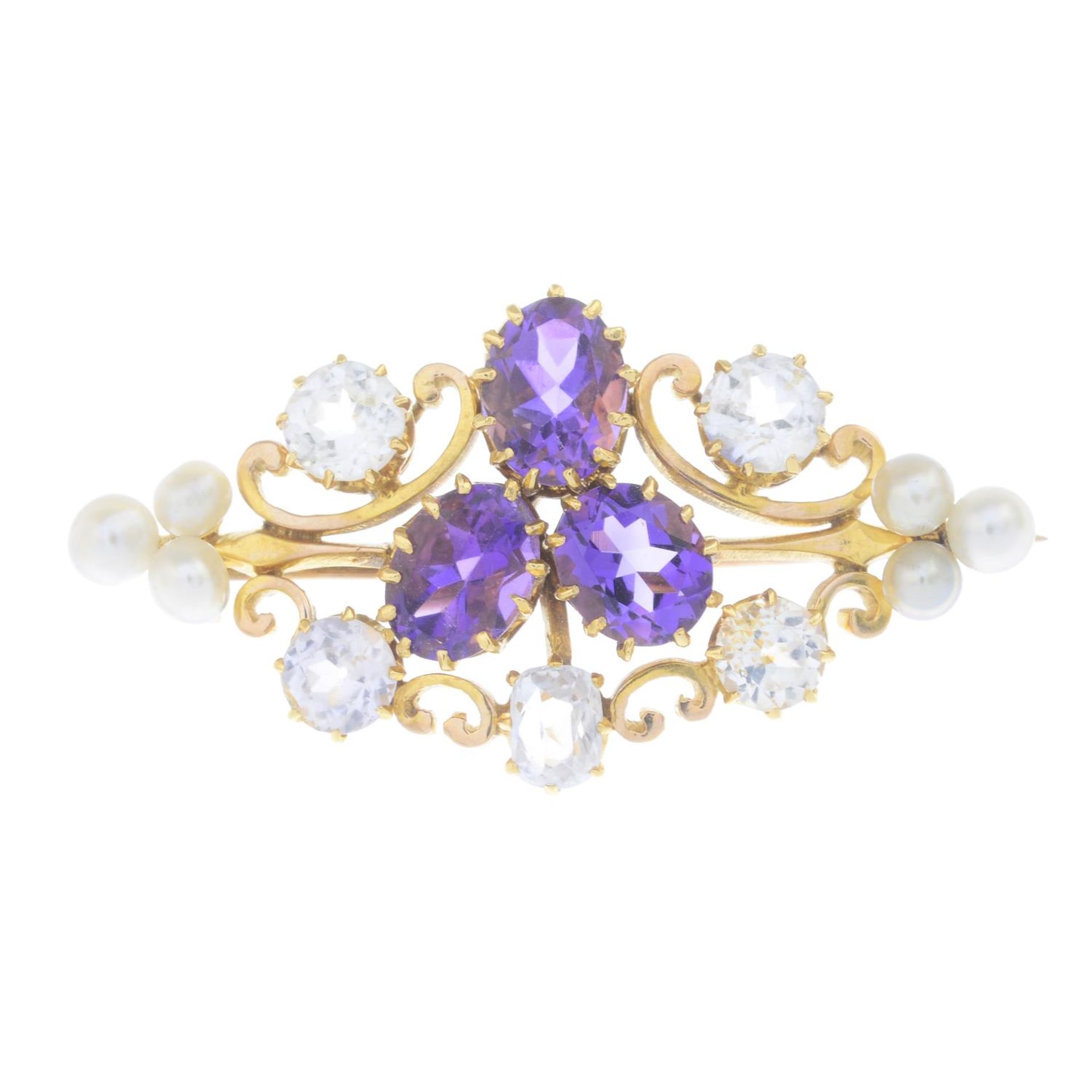 An early 20th century gold amethyst, white sapphire and pearl brooch.