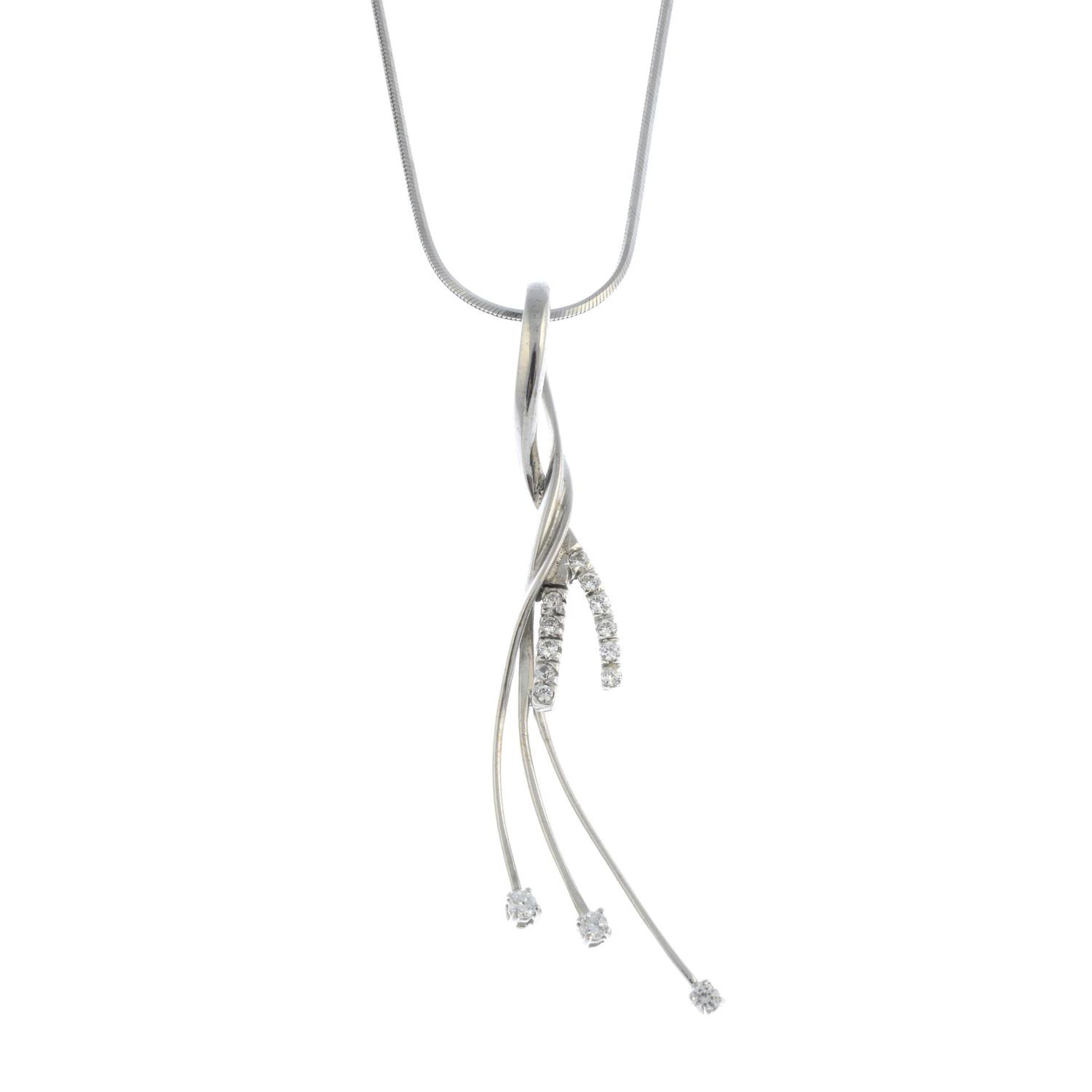 A cubic zirconia pendant, suspended from a snake-link chain.Chain stamped 750.