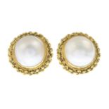 A pair of mabe pearl earrings.Approximate dimensions of one mabe pearl 12.3 by 12.2mms.