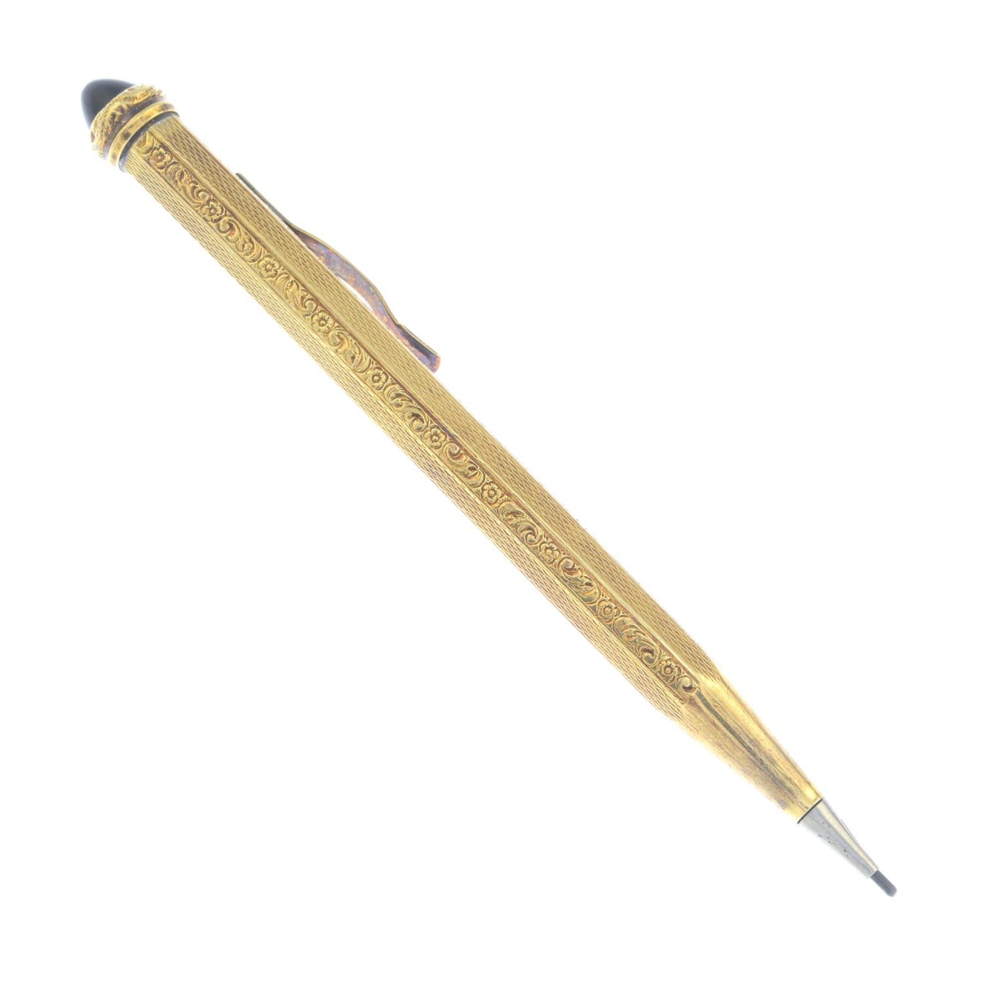 An early 20th century pencil, with onyx terminal.Stamped 585.Length 11.5cms.