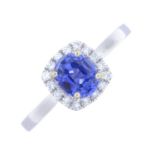 A sapphire and diamond cluster ring.Estimated total diamond weight 0.15ct.