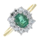 An emerald and diamond cluster ring.Estimated total diamond weight 0.25ct.