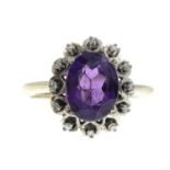 An amethyst and diamond cluster ring.Stamped 18ct.Ring size M1/2.