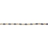 A 9ct gold sapphire bracelet, with diamond spacers.Estimated total diamond weight 0.10ct.