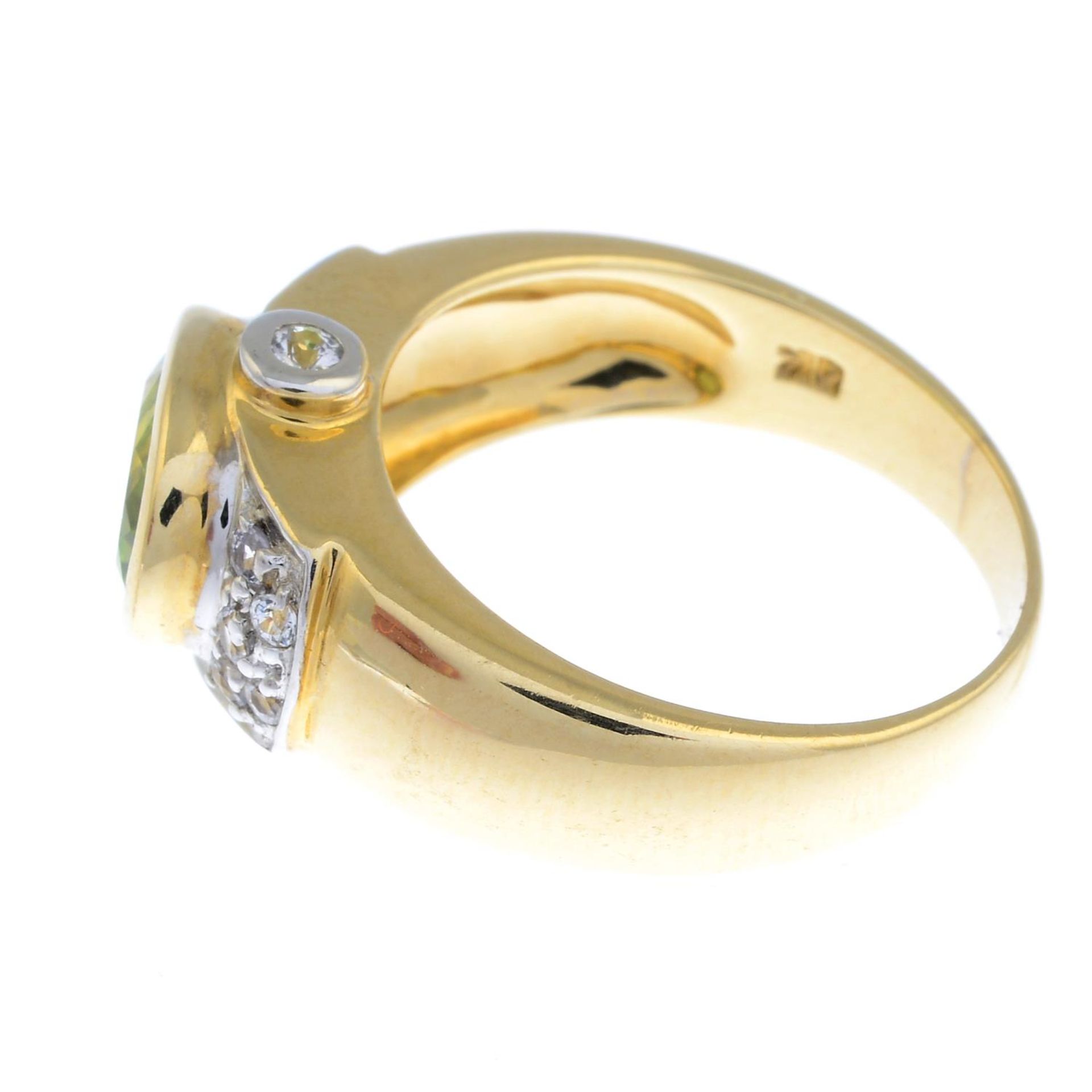 A 9ct gold peridot and cubic zirconia dress ring.Hallmarks for 9ct gold. - Image 3 of 3