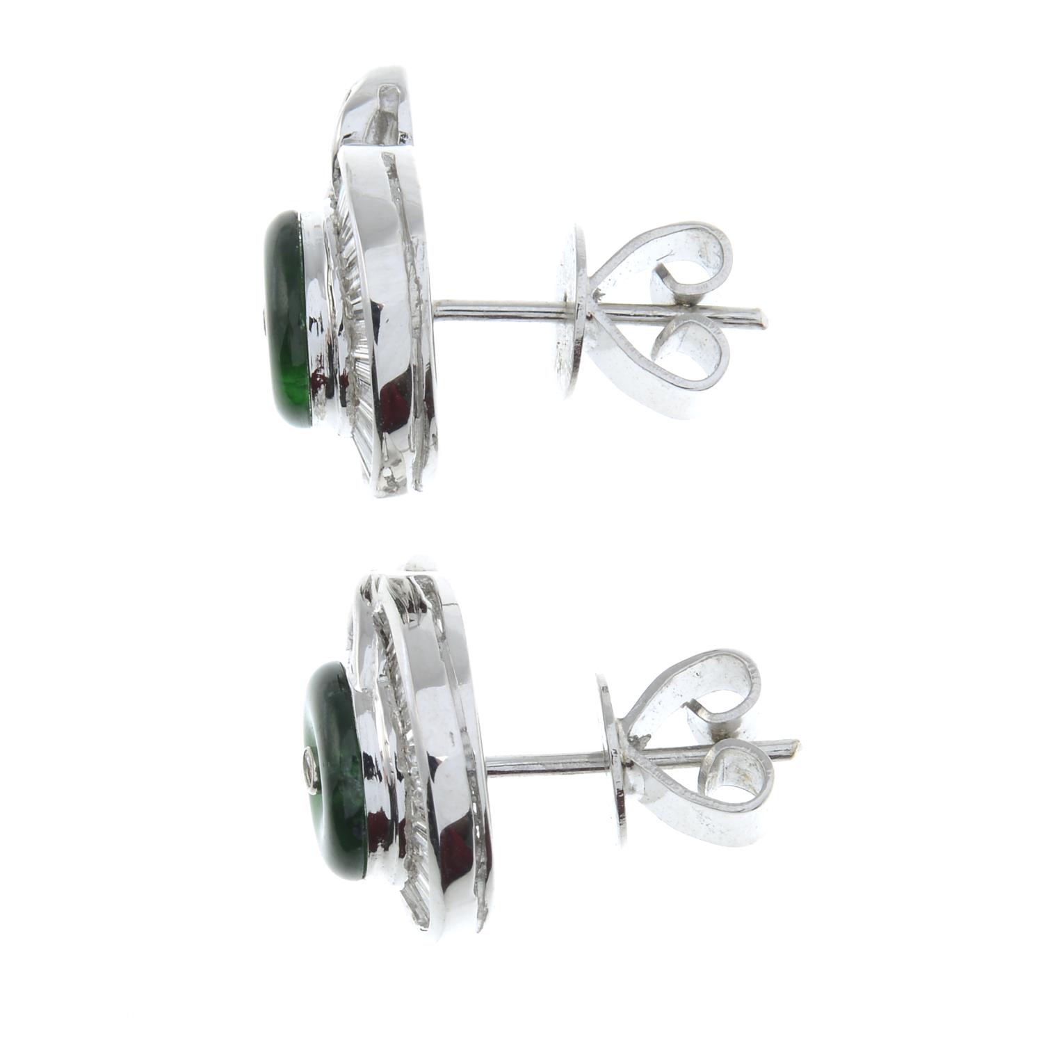 A pair of baguette-cut diamond and emerald cluster earrings.Estimated total diamond weight 0.70ct. - Image 2 of 2