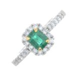 A platinum emerald and brilliant-cut diamond cluster ring.Emerald weight 0.42ct.Total diamond