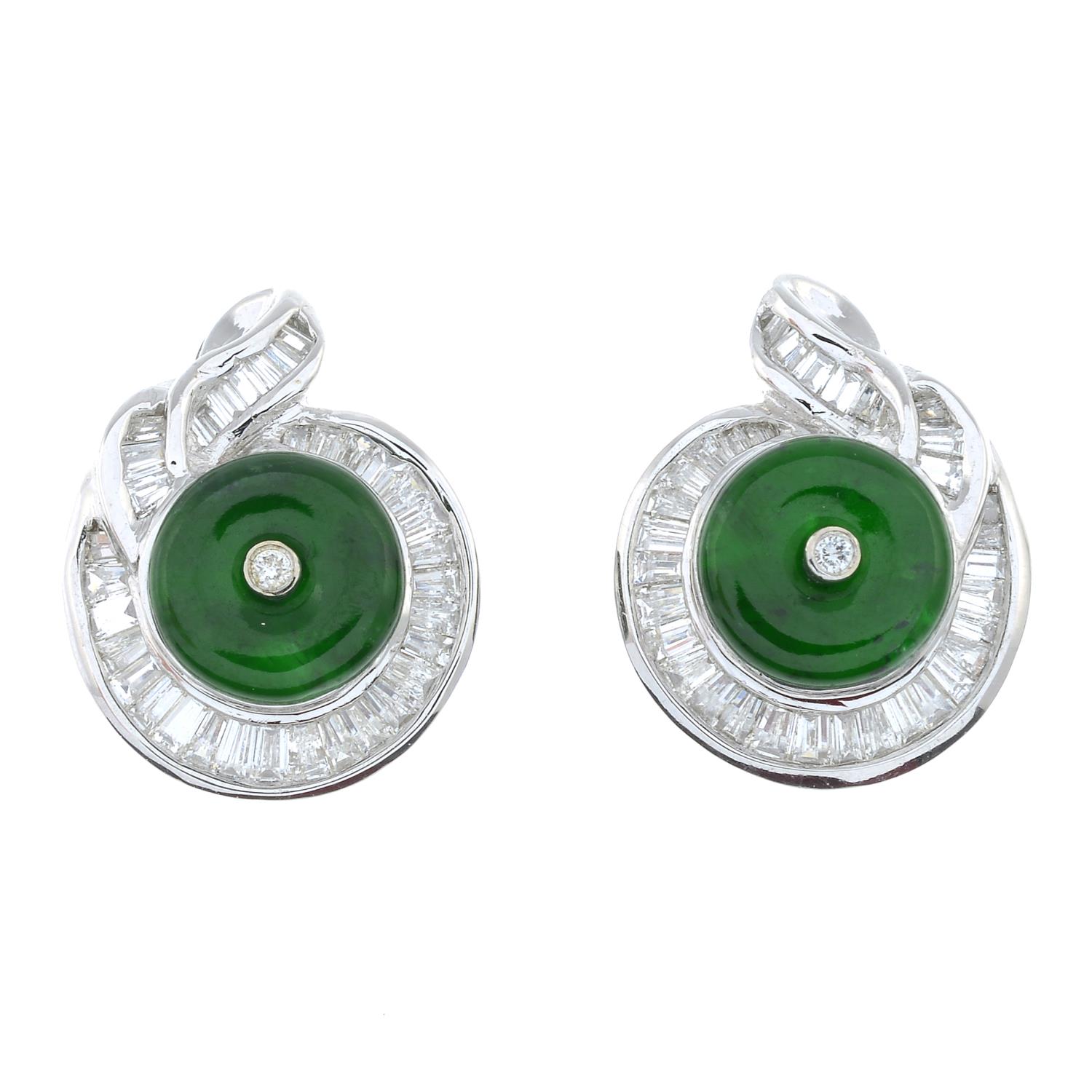 A pair of baguette-cut diamond and emerald cluster earrings.Estimated total diamond weight 0.70ct.