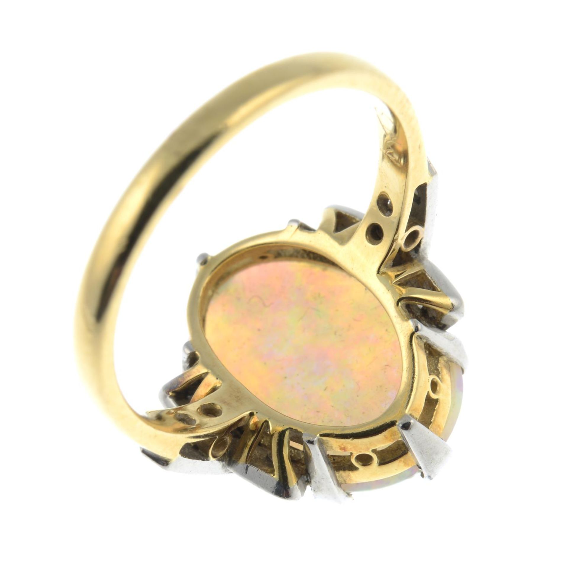 An opal cabochon and circular-cut diamond dress ring.Estimated total diamond weight 0.15ct, - Bild 2 aus 3