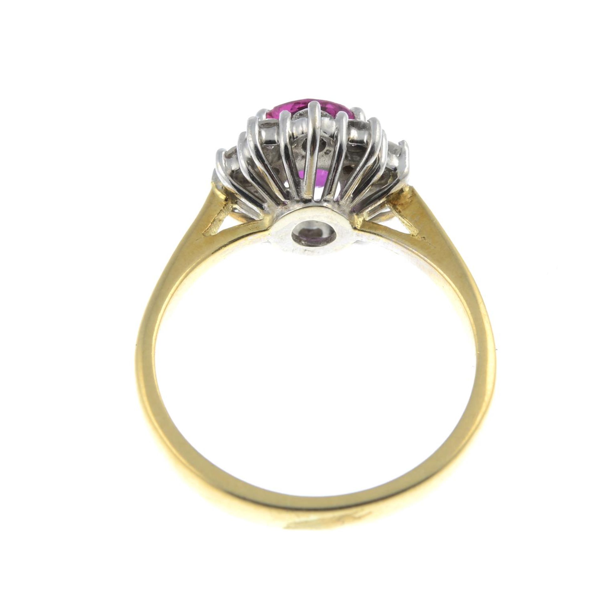 An 18ct gold ruby and brilliant-cut diamond cluster ring.Ruby calculated weight 0.77cts, - Bild 2 aus 3