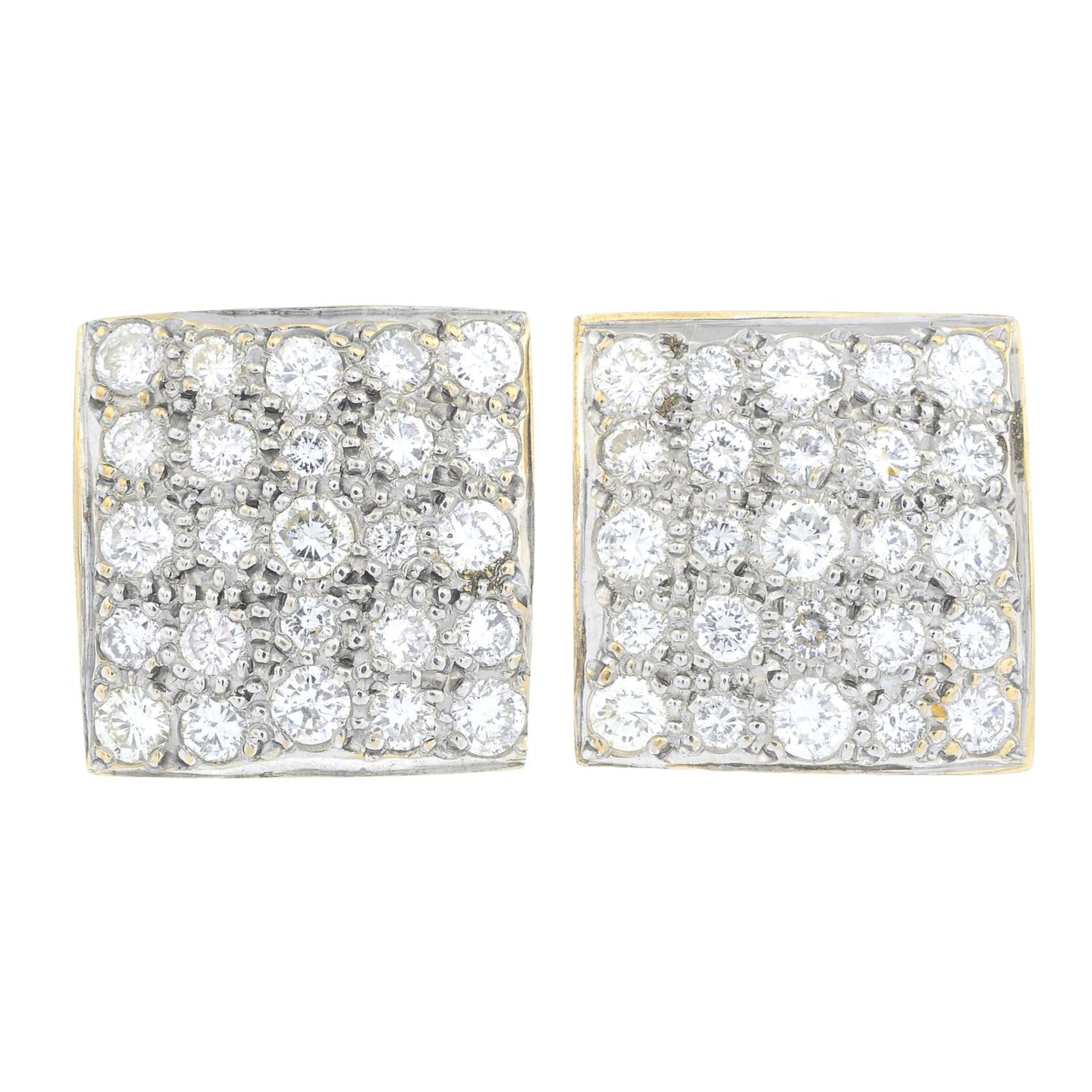A pair of brilliant-cut diamond cluster stud earrings.