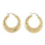 A pair of 9ct gold earrings.Hallmarks for 9ct gold.