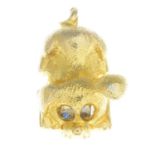 A 1960s 9ct gold dog charm with rotating eyes.Hallmarks for Birmingham, 1968.