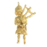A 1970s 9ct gold Scottish bagpiper charm.Hallmarks for London, 1975.