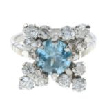 A diamond and blue zircon dress ring.Estimated total diamond weight 1.20cts.