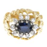 A sapphire and brilliant-cut diamond cluster ring.Estimated total diamond weight 0.30ct.Stamped