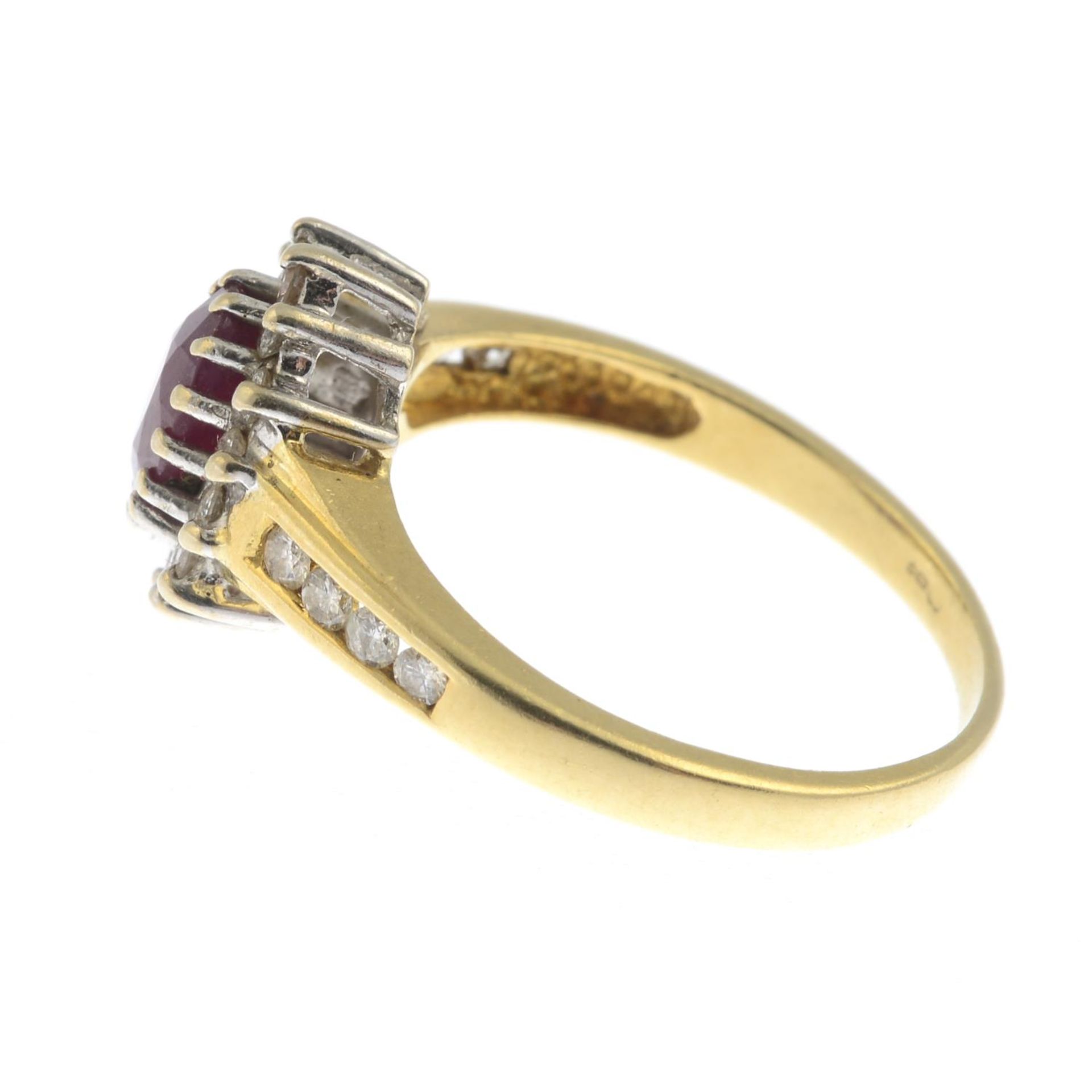 An 18ct gold ruby and diamond cluster ring.Total diamond weight 0.33ct, stamped to band. - Bild 3 aus 3