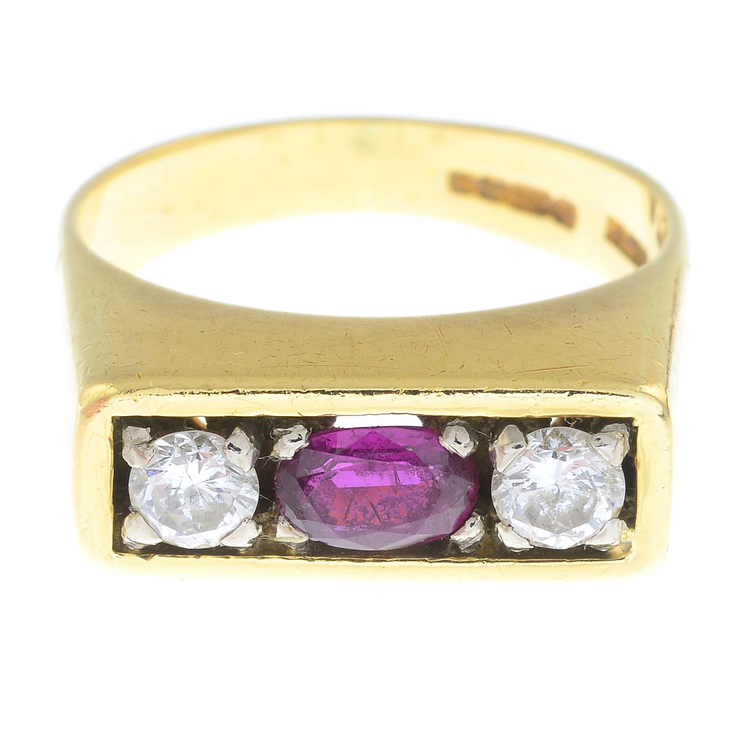 An 18ct gold ruby and brilliant-cut diamond three-stone ring.