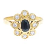 An 18ct gold sapphire and brilliant-cut diamond cluster ring.Estimated total diamond weight