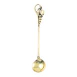 An early 20th century 9ct gold condiment spoon.Stamped 9ct.Length 7cms.