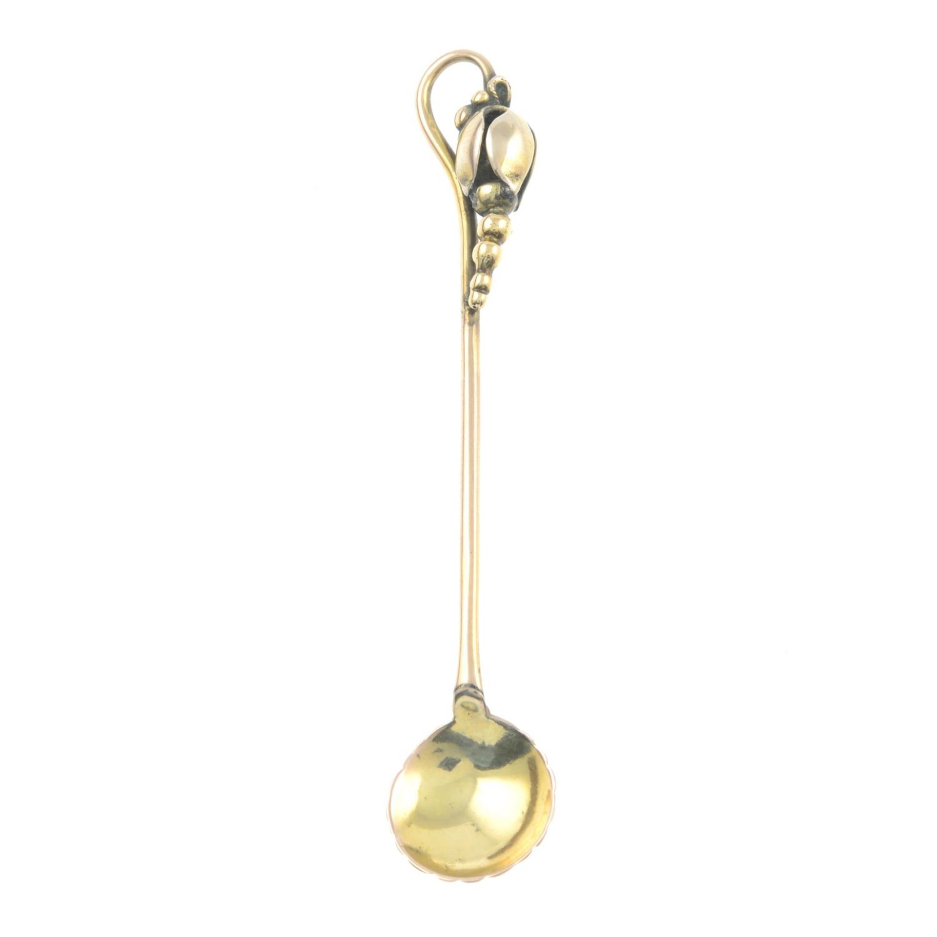 An early 20th century 9ct gold condiment spoon.Stamped 9ct.Length 7cms.