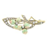 An early 20th century Art Nouveau 15ct gold enamel and split pearl brooch.Stamped 15ct.