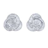 A pair of 9ct gold diamond earrings.Estimated total diamond weight 1ct.