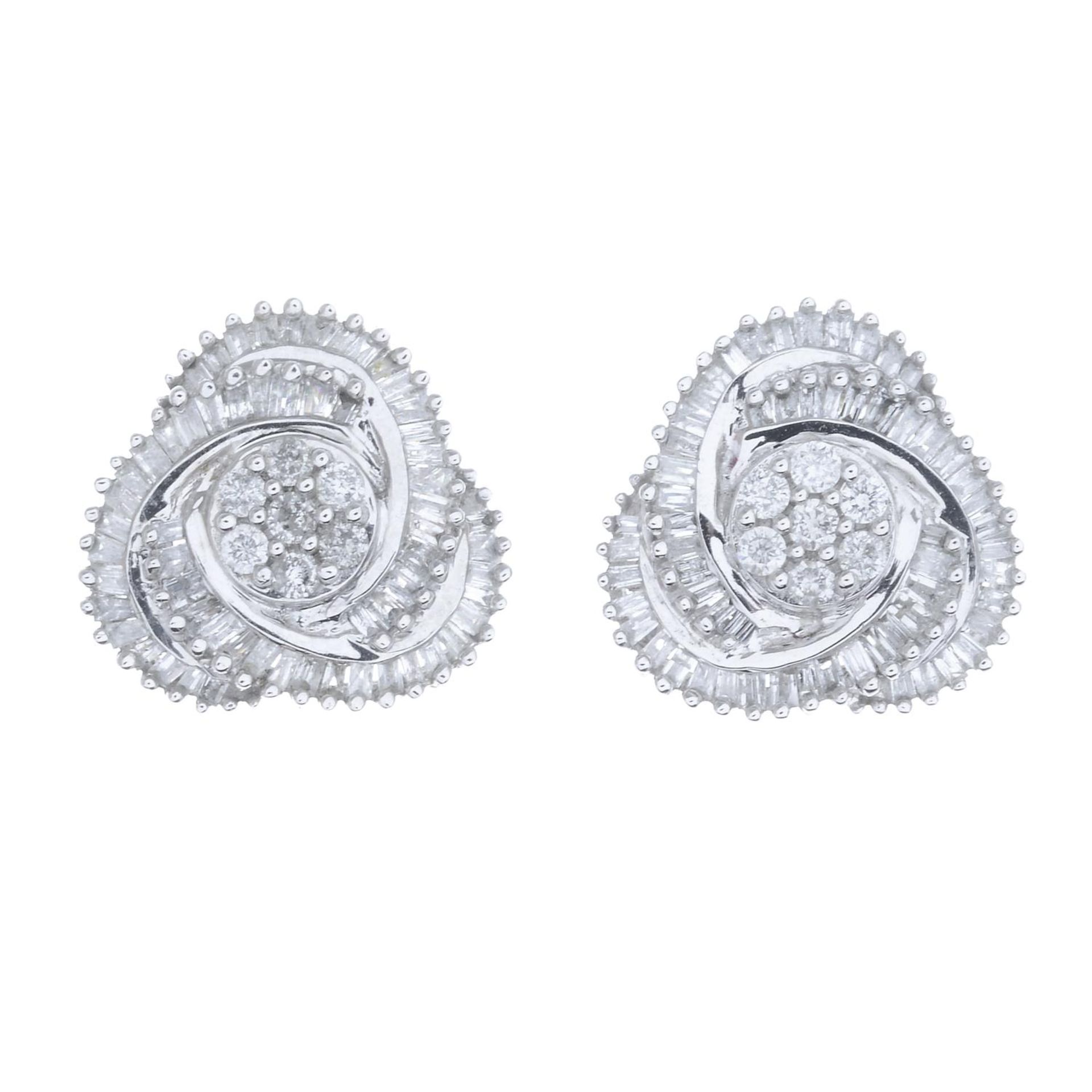 A pair of 9ct gold diamond earrings.Estimated total diamond weight 1ct.