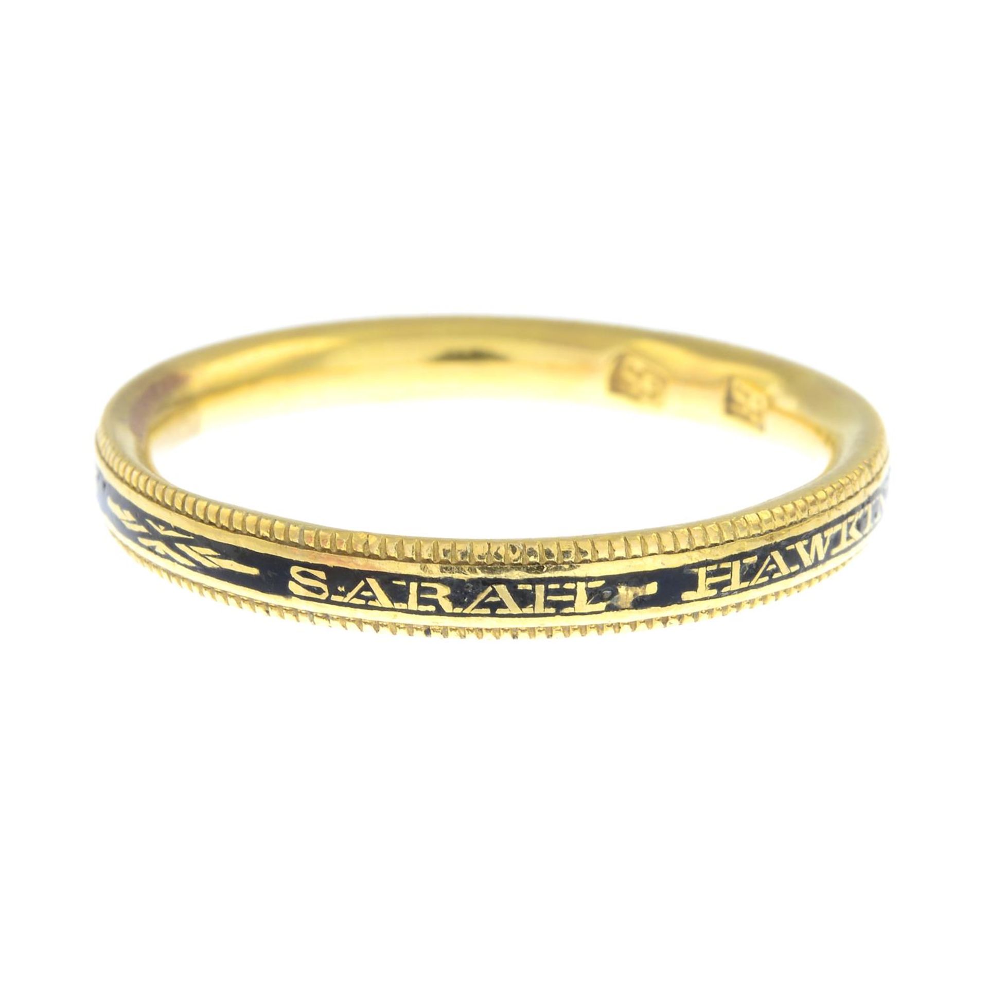 A Georgian gold and black enamel memorial ring.