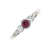 A 9ct gold synthetic ruby and diamond three-stone ring.