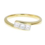 An 18ct gold diamond three-stone ring.Estimated total diamond weight 0.60ct,