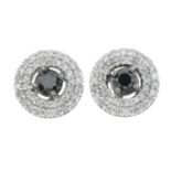 A pair of diamond and black gem cluster stud earrings.Estimated total diamond weight 0.50ct.Stamped