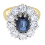 An 18ct gold sapphire and brilliant-cut diamond cluster ring.Estimated total diamond weight