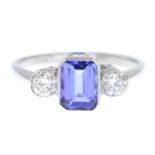 A tanzanite and brilliant-cut diamond three-stone ring.Tanzanite weight 1.25cts.Estimated total