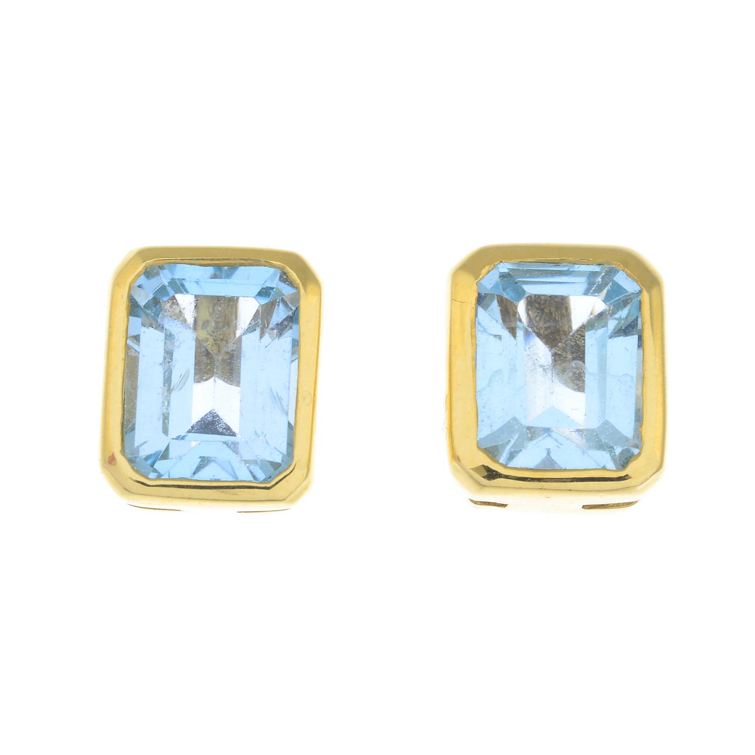 A pair of blue topaz stud earrings.
