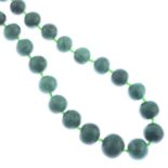 A malachite single-strand necklace, with green paste spacers.Length 68cms.