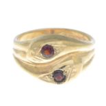 A 9ct gold snake ring, with red gem crest highlights.Hallmarks for 9ct gold.