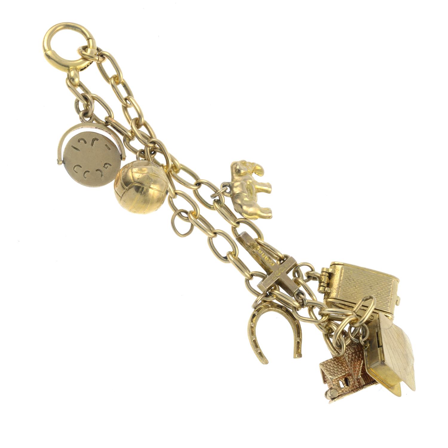 An 18ct gold bracelet, suspending eight 9ct gold charms.Bracelet with hallmarks for 18ct gold. - Image 2 of 2