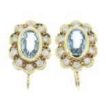 A pair of aquamarine and brilliant-cut diamond cluster earrings.Estimated total diamond weight