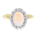 An opal and diamond cluster ring.Stamped 18CT.