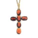 A 9ct gold garnet cross pendant, with chain.Pendant with hallmarks for 9ct gold.