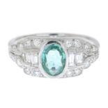 An emerald and brilliant and baguette-cut diamond dress ring.Emerald weight 0.65ct.Estimated total