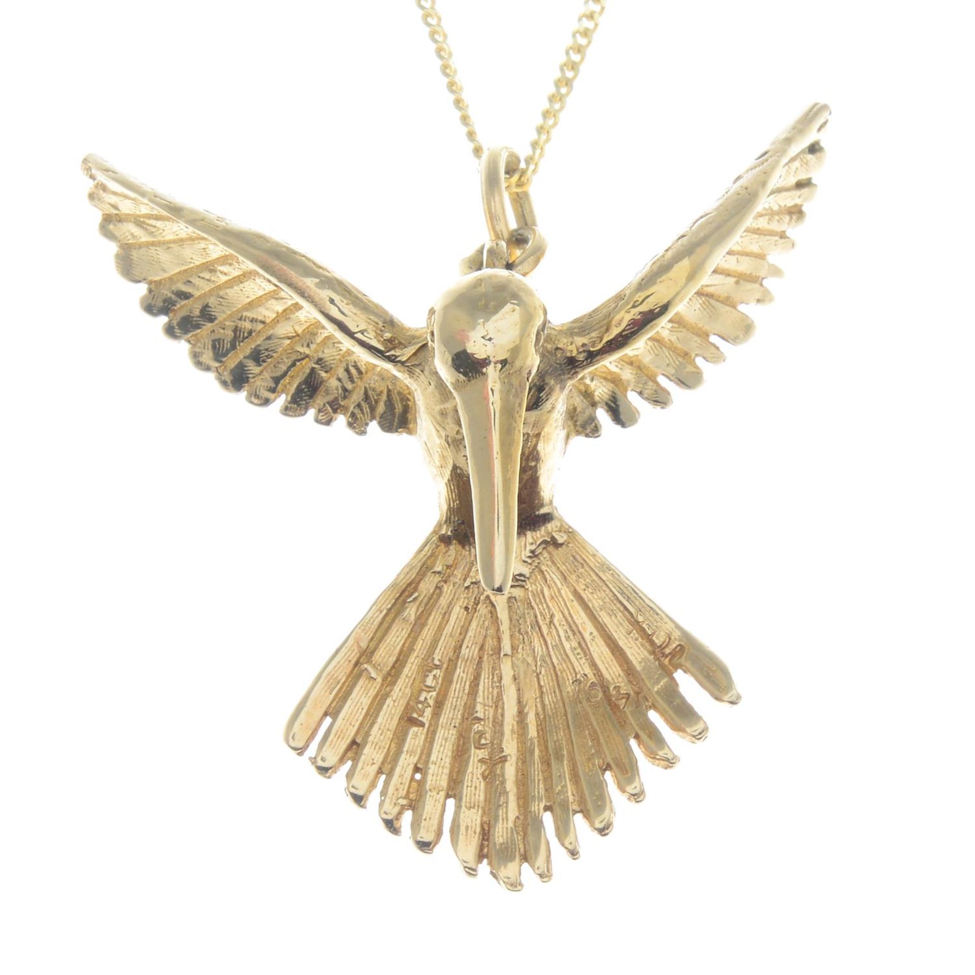 A pendant, depicting a textured hummingbird in flight, with 9ct gold chain.