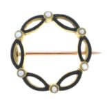 An early 20th century 15ct gold split pearl and black enamel wreath brooch.Stamped 15ct.Diameter