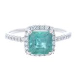 An emerald and diamond dress ring.Emerald weight 1.56cts.