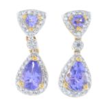 A pair of 18ct gold tanzanite and diamond earrings.Estimated total diamond weight 0.50ct.
