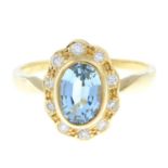 An aquamarine and brilliant-cut diamond cluster ring.Total diamond weight 0.21ct,